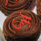 Cup cake with initials iced onto cake